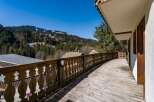 Enjoy breathtaking mountain views from this charming balcony.