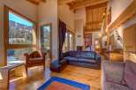 Experience luxury living in this stunning property, featuring expansive windows that frame breathtaking mountain views.