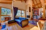 Experience luxury living in this stunning property featuring a cozy living room with a fireplace and a comfortable sofa.