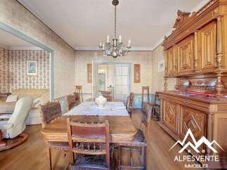 Step into a charming dining room with a classic, vintage aesthetic.