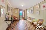 Discover the charm of this inviting property, featuring a welcoming entrance hall adorned with artistic touches.