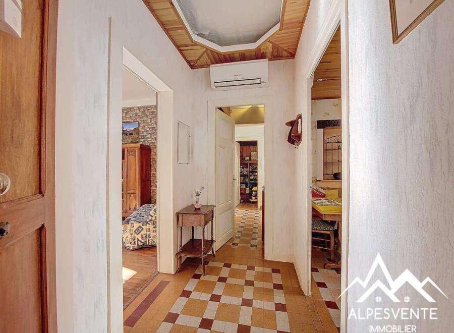 Discover the charm of this inviting property, featuring a beautifully designed hallway with a unique tiled floor.
