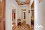 Discover the charm of this inviting property, featuring a beautifully designed hallway with a unique tiled floor.