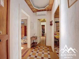 Discover the charm of this inviting property, featuring a beautifully designed hallway with a unique tiled floor.