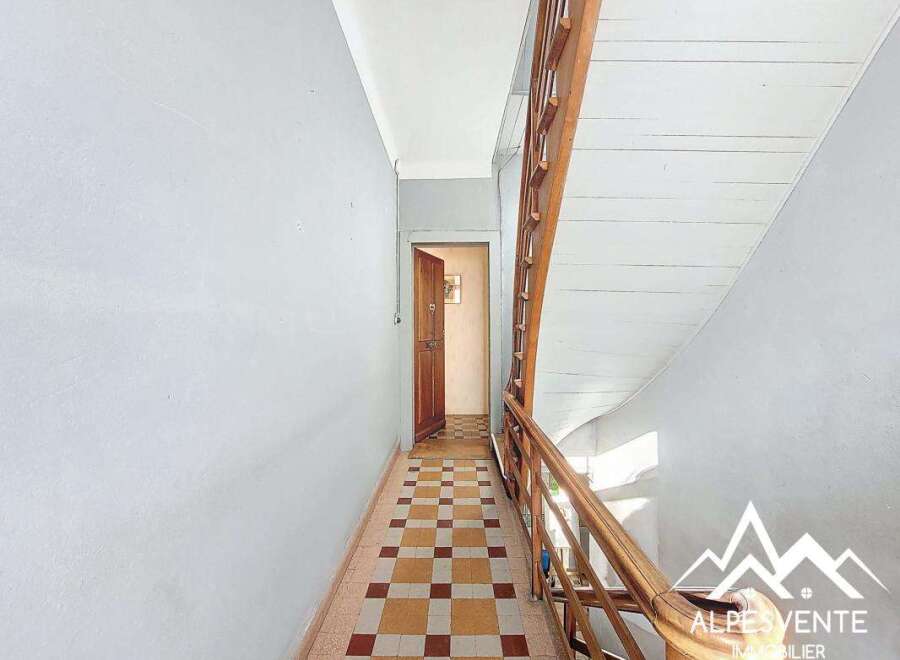 Discover this charming property featuring a classic staircase and a welcoming hallway.