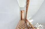 Discover this charming property featuring a classic staircase and a welcoming hallway.