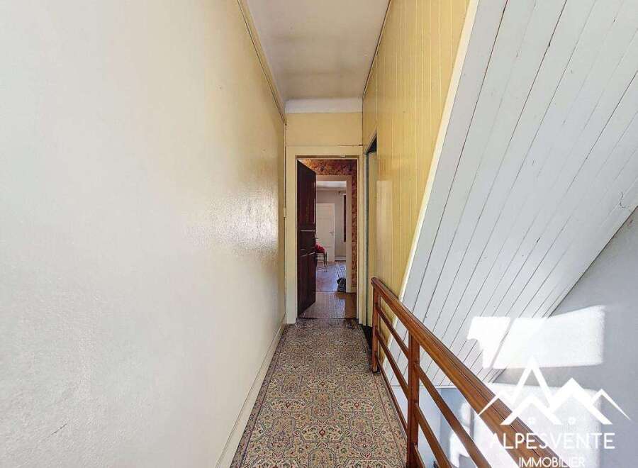 Explore this charming property featuring a hallway with a classic design.