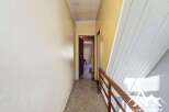 Explore this charming property featuring a hallway with a classic design.