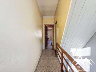 Explore this charming property featuring a hallway with a classic design.