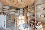 Discover the charm of this unique property, featuring a rustic wine cellar perfect for storage and display.