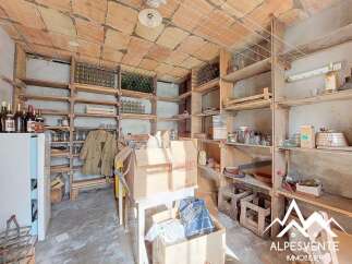 Discover the charm of this unique property, featuring a rustic wine cellar perfect for storage and display.