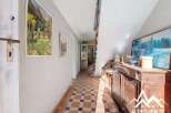 Discover the charm of this inviting hallway, featuring a classic tiled floor and a warm, welcoming atmosphere.