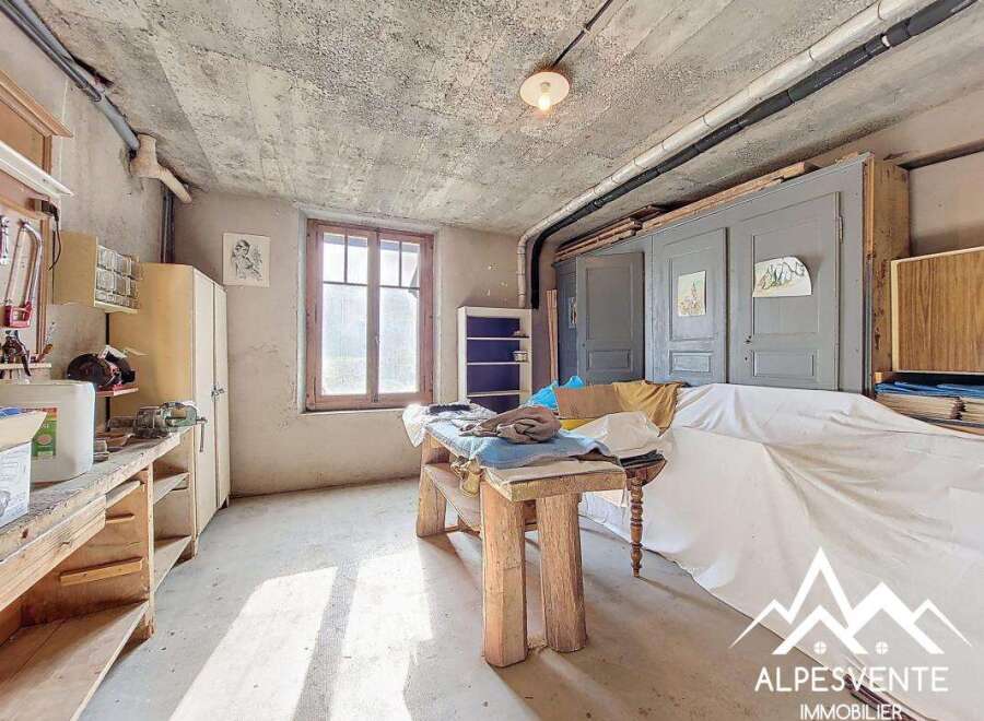 Discover the potential of this unique property, featuring a spacious workshop area perfect for creative projects or hobbies.