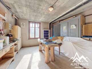 Discover the potential of this unique property, featuring a spacious workshop area perfect for creative projects or hobbies.
