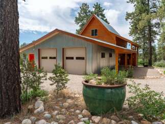 This stunning property boasts a unique blend of rustic charm and modern design.
