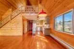 Step into this stunning home featuring a warm and inviting interior with beautiful wooden accents throughout.