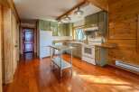 Step into this charming kitchen with its warm, inviting ambiance.