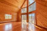 Step into this stunning cabin with its warm, inviting wood paneling and soaring ceilings.