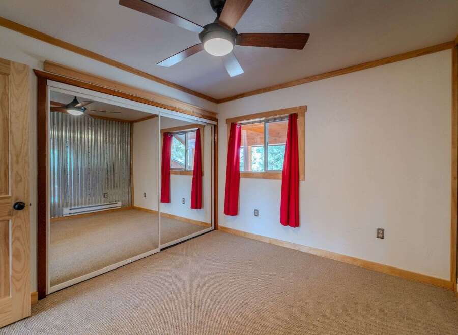 Step into this inviting bedroom, featuring a unique blend of rustic charm and modern comfort.