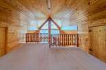 Step into this stunning loft space, showcasing a warm, inviting ambiance with its all-wood construction.