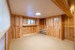 This stunning property boasts a beautifully designed interior with custom cabinetry and ample storage space.