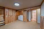 This stunning property boasts a spacious laundry room with ample storage and a modern design.