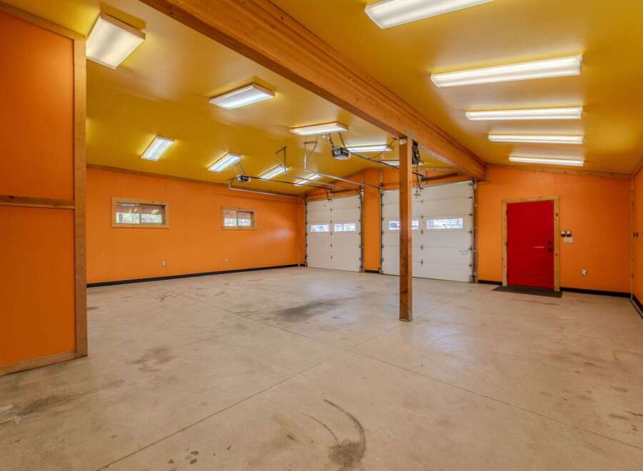 This spacious garage offers ample room for vehicles and storage.