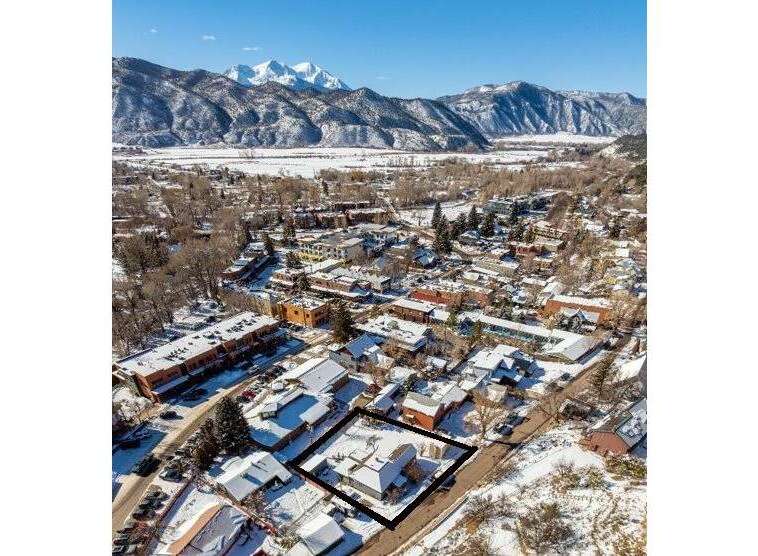Discover a charming property nestled in a picturesque winter landscape.