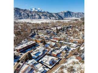 Discover a charming property nestled in a picturesque winter landscape.