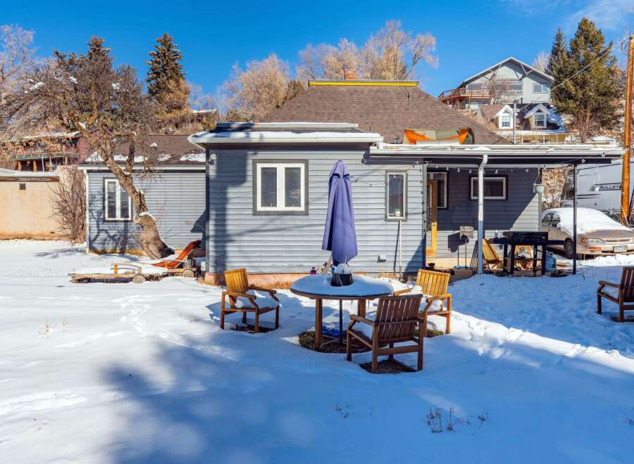 This charming property boasts a cozy outdoor space perfect for enjoying the crisp winter air.