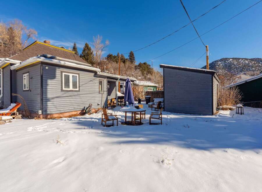 This charming property boasts a cozy outdoor space, perfect for enjoying the crisp winter air.