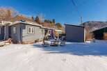 This charming property boasts a cozy outdoor space, perfect for enjoying the crisp winter air.