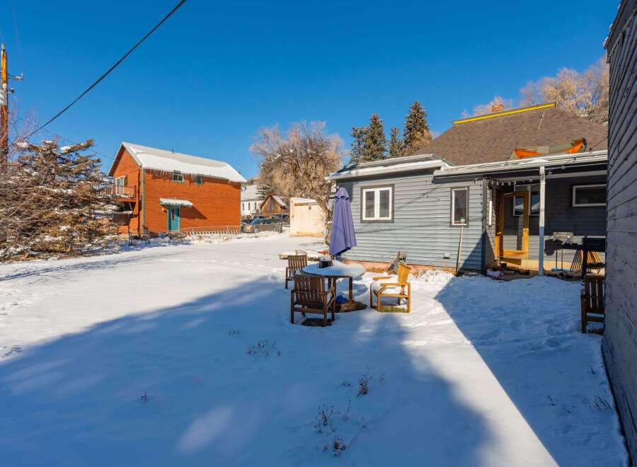 This charming property boasts a cozy outdoor space perfect for enjoying the crisp winter air.