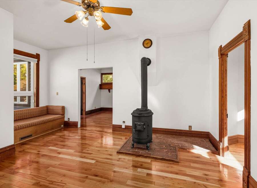 Step into this charming home and be greeted by the warmth of hardwood floors and natural light.