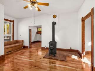 Step into this charming home and be greeted by the warmth of hardwood floors and natural light.