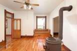 Step into this charming home featuring beautiful hardwood floors and a cozy built-in bench seat.