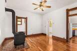 Step back in time with this charming property featuring original hardwood floors and a cozy wood-burning stove.
