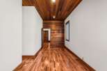 Step into this stunning space featuring exquisite wood flooring and a warm, inviting ambiance.
