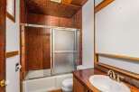 Step into this charming bathroom featuring a unique brick-style tile design that adds character and warmth.