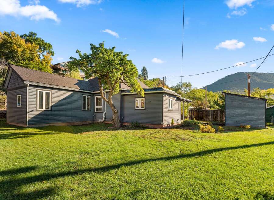 Charming home with a beautiful yard and a detached shed.