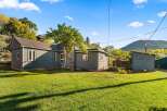 Charming home with a beautiful yard and a detached shed.