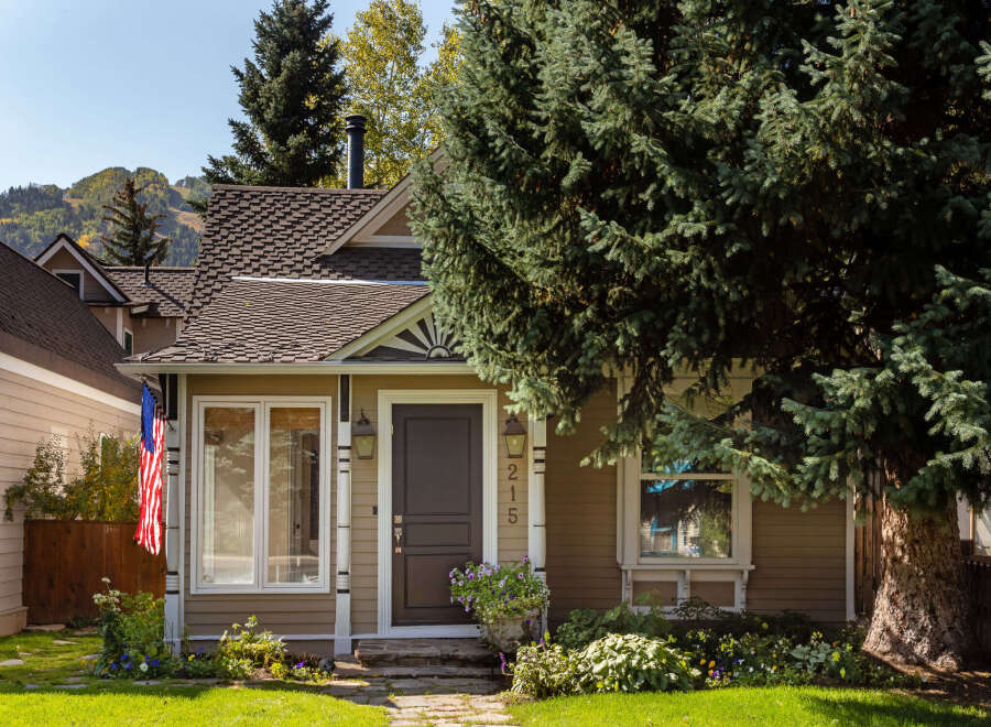 Charming home with a welcoming facade, featuring a well-maintained exterior and inviting front porch.