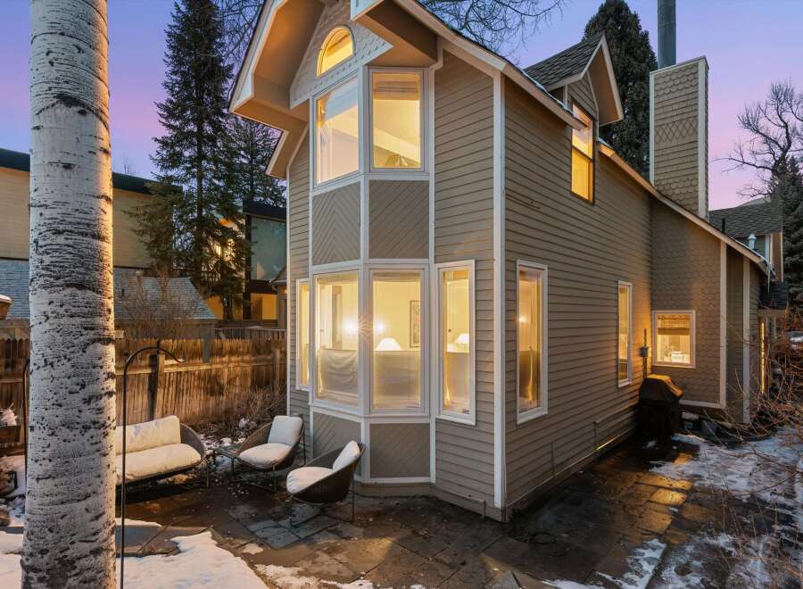 This charming home boasts a unique architectural design with multiple windows, offering ample natural light and stunning views.