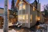 This charming home boasts a unique architectural design with multiple windows, offering ample natural light and stunning views.