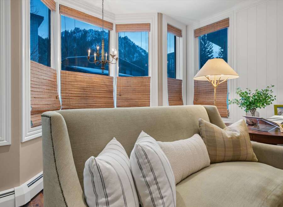 Step into a cozy living space with stunning mountain views.