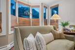 Step into a cozy living space with stunning mountain views.