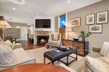 Experience luxury living in this stunning property, featuring a cozy fireplace and elegant decor.
