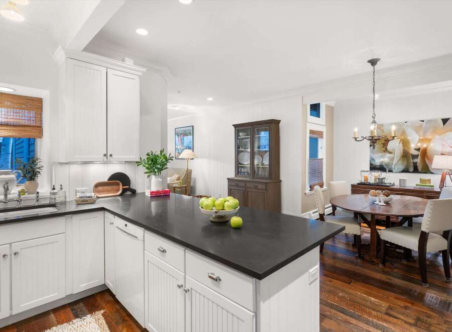 This stunning kitchen boasts a sleek, modern design with a spacious island perfect for meal prep and entertaining.