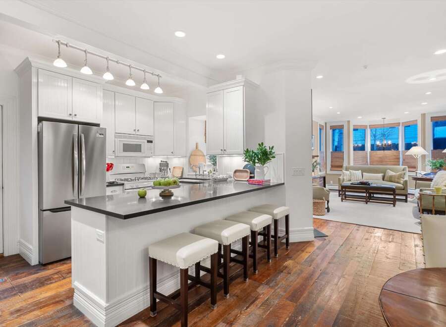 This stunning kitchen boasts a sleek, modern design with stainless steel appliances and ample counter space.