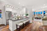 This stunning kitchen boasts a sleek, modern design with stainless steel appliances and ample counter space.
